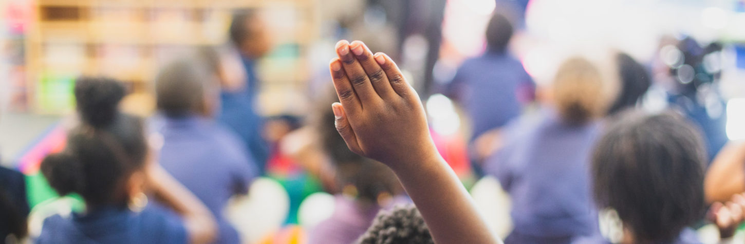 Girl raising her hand